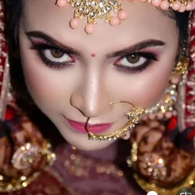 An intense, top down view of this bride's dramatic eye makeup. The deep, kohl rimmed eyes and perfectly sculpted brows create a powerful and mesmerizing look that is all about the details.