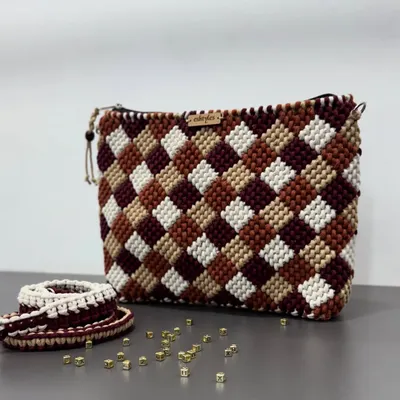 This checkered pattern is a customer favorite! This one features a beautiful mix of earthy tones like maroon, brown, and beige.