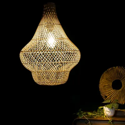 Illuminate your space with one of my exquisite handcrafted bamboo pendant lights. This piece, with its intricate weave, casts a warm, patterned glow perfect for homes and restaurants.