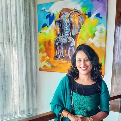 A wonderful client posing with her new 'Mother Love' elephant painting. The large, colorful canvas brings so much life to her beautiful home, and her smile says it all.