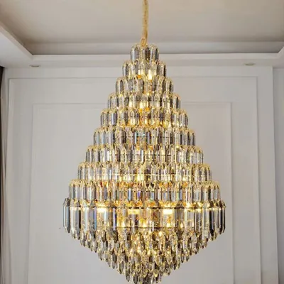 This diamond-shaped crystal chandelier is a modern marvel, constructed with high-quality K4 crystal for maximum brilliance. It is specifically designed as a double-height fixture, perfect for making a grand statement in a modern home's entryway.
