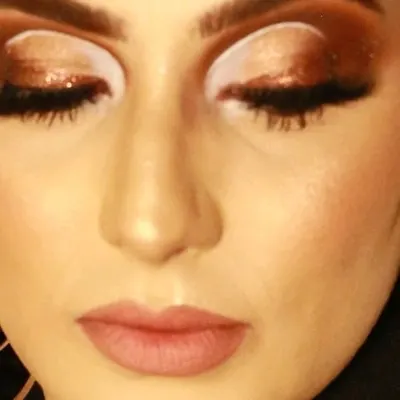 A close-up look at a cut-crease eye makeup style with a touch of glitter. Mastering techniques like this is a key part of my advanced makeup course, where we focus on precision, blending, and creating impactful eye looks.
