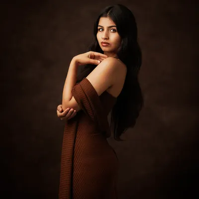 A fine art portrait for those who value legacy and emotion. The rich brown tones and her elegant pose create a feeling of timeless beauty.