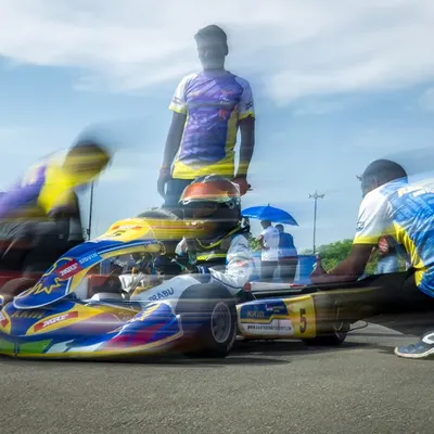 A dynamic shot of our pit crew making last-minute adjustments on the grid before a race.