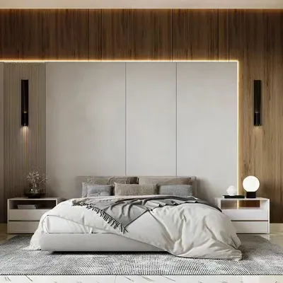 A serene and minimalist bedroom design featuring a wood-paneled accent wall with integrated strip lighting. The low-profile bed and simple side tables create a clean, uncluttered space perfect for relaxation.