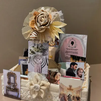 Dearest gentle reader, this Bridgerton-themed hamper is the talk of the ton. We curated it with elegant items and imagery from the show, all presented in a lace and burlap basket fit for a duchess.
