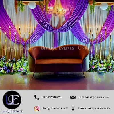 We designed this elegant stage for a formal corporate gathering. The setup features luxurious purple drapery, a central chandelier for sophisticated lighting, and custom floral arrangements to create a polished and high-end atmosphere perfect for awards ceremonies, gala dinners, or celebratory brand events.