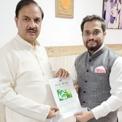 Presenting the 'Mera Ghar - Mera Haq' charter to MP Dr. Mahesh Sharma. This initiative provides free legal consultation and raises awareness about the rights of homebuyers, aiming to empower individuals against unfair developer practices.