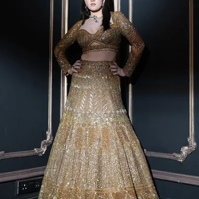An ethereal vision draped in gold for a campaign shoot. We created a look with radiant, softly lit skin and bold smoky lids for a touch of drama.