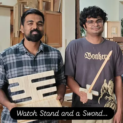 A fun assortment of projects from a workshop: a handmade wooden sword and a custom watch stand, proving that woodworking can be both playful and practical.