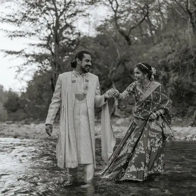 This black and white shot of Nikita and Sachin walking through the Ganga in their wedding clothes is the definition of an adventurous couple. It was cold, but their willingness to do something different resulted in truly memorable and artistic wedding portraits.