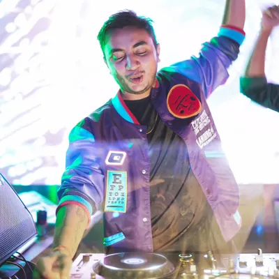 A close-up action shot of me feeling the music while mixing. This captures the passion I have for my craft.