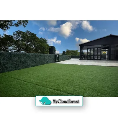 My services extend to large-scale projects, including expansive lawns and privacy screening. Here, I installed premium artificial grass for a perfectly manicured look without the upkeep, complemented by a tall, dense artificial hedge that provides immediate and lasting privacy.