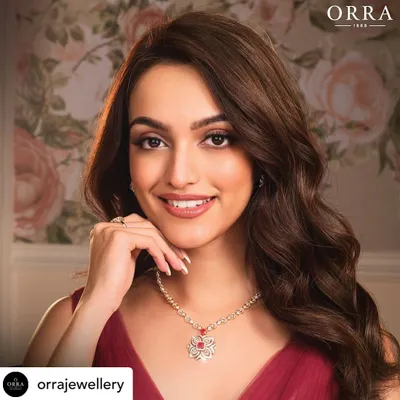 A stunning final shot from a jewelry campaign. The makeup is clean, elegant, and designed to complement the diamond necklace, enhancing the model's beauty without overpowering the product.