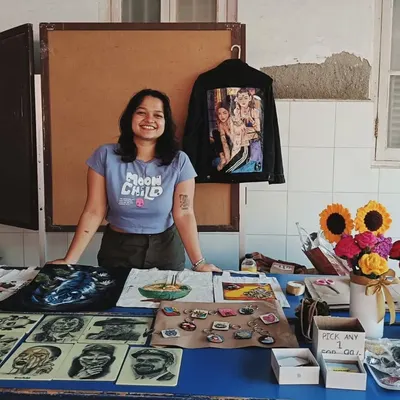 Here I am at a local college festival, so happy to be sharing my work. Events like these are amazing because I get to connect with people who love art as much as I do.