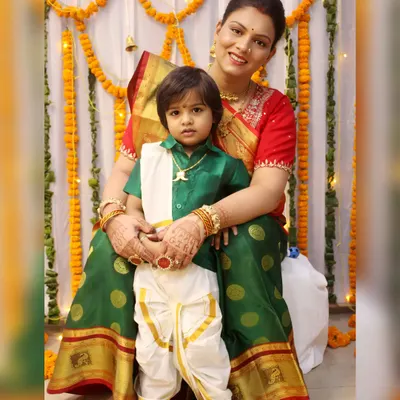 A mother and son dressed in beautiful traditional South Indian attire for a ceremony. We are experienced in photographing various cultural events and their specific dress codes.