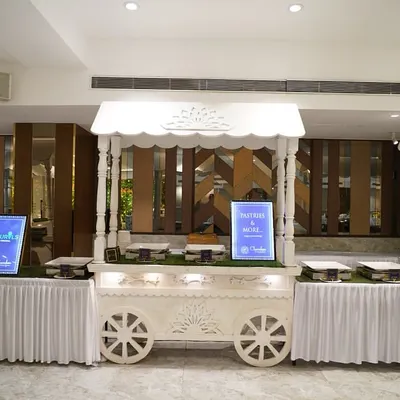 My signature white food cart, designed to be both functional and a beautiful decor piece. It can be customized for any food station, like this one for a Haldi ceremony.