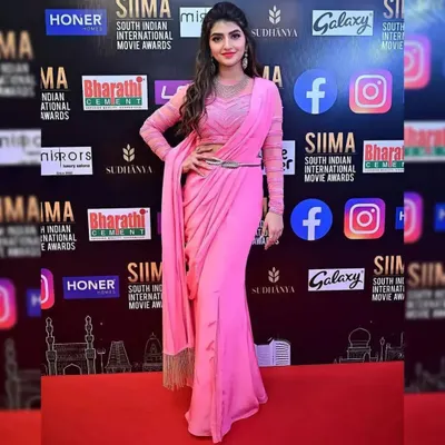 Actress Sreeleela looking radiant on the SIIMA Awards red carpet in our modern pink pre-draped saree. You can rent this exact celebrity-worn outfit for your special event.