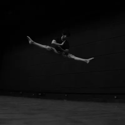A moment of flight. This black and white shot captures the explosive energy and athleticism that I strive to bring to my dance.
