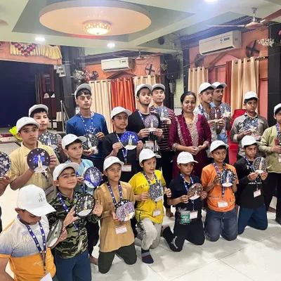 This group photo with students from the Hum Foundation is one of my most cherished memories. Each child is holding their unique creation from our Chandrayaan kit workshop, a testament to their creativity and resilience.
