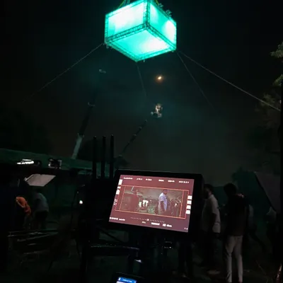 A view from behind the monitor on the set of 'Kishkindhapuri'. This shot shows the final image on screen, with our crane-mounted, color-changing moonbox visible in the background.