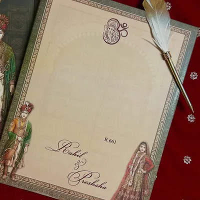 A simple yet beautiful insert for writing a personal note, featuring a feather quill and classic calligraphy with the couple's names.