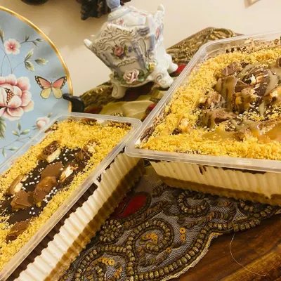 My bestseller, the Twixter dessert, ready to go out in trays. It's a creamy, dreamy dessert with layers of chocolate, caramel, and crunchy Twix pieces.
