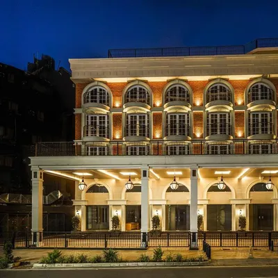 For the Museum Inn's exterior, my goal was to enhance its classic architectural beauty. By carefully placing uplights within the arches and along the facade, I was able to create depth and highlight the intricate details, giving the building a stately and elegant glow.