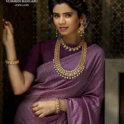 An elegant look we created for Vummidi Bangaru Jewellers. We paired a beautiful purple silk saree with a stunning multi-layered pearl and polki necklace set. The simple blouse and classic drape allow the intricate jewellery to truly shine.