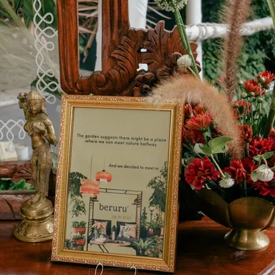 A personalized sign at a wedding reception, referencing the couple's meeting place and adding a unique, storytelling element to the decor.