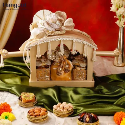 This Shubh Vivah Invite Box is designed to accompany your wedding invitations. Shaped like a traditional doli, it holds nuts and mithai, offering a blessing of togetherness to your guests as you announce your joyful beginning.