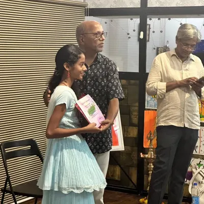 Saanvi Rane, a 7th grader, receiving her certificate for securing an 'A' grade in her art exam. This is a testament to her hard work in our printmaking sessions.
