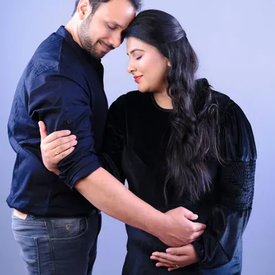 This is what it's all about: the quiet connection and support. A simple studio portrait of a couple embracing captures the tenderness of this shared journey.