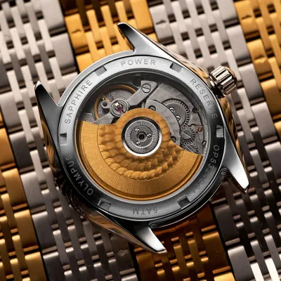 The heart of the watch. I love shooting exposed case backs because they reveal the incredible engineering inside. For this Argos Olympus, I used a Hasselblad X2D to capture every gear and jewel with absolute clarity, laying it on a bed of watch links to create texture and context.