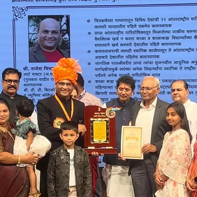 The official photograph from the State Teacher Award ceremony, where I was felicitated by the Education Minister. My family's presence made this moment even more special.
