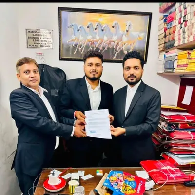 Congratulating an intern on the successful completion of their training with our firm. We believe in providing practical experience to the next generation of legal professionals.