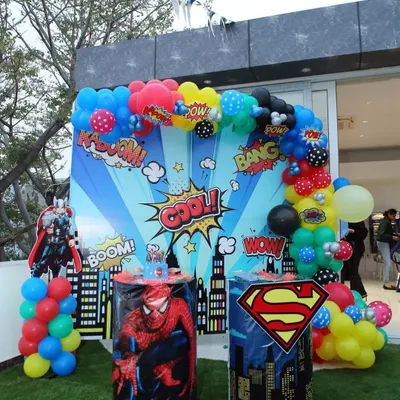A classic superhero setup featuring a comic book style backdrop with Spiderman and Superman pedestals. I design these photo corners to be the center of attention, perfect for capturing those powerful hero poses.