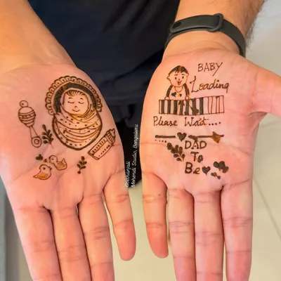A special design for the dad-to-be. This fun mehendi includes a 'Baby Loading' bar and a cute drawing of a baby in a cradle.