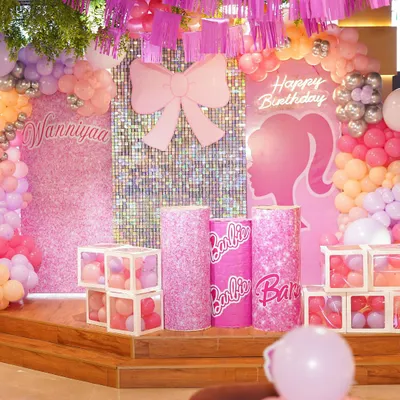 A stunning Barbie-themed birthday setup, complete with a shimmering backdrop, custom pedestals, and a cascade of pink and pastel balloons. We design every element to create a picture-perfect party scene.