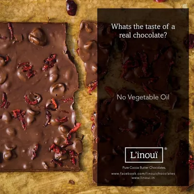 What's the taste of a real chocolate? For us, it means no vegetable oil. This image of our cranberry chocolate bark reinforces our commitment to using only pure cocoa butter for an authentic texture and taste.