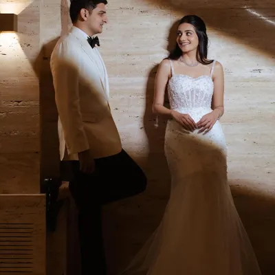 A romantic shot of a cocktail bride. I styled her hair in a simple and elegant half-updo to complement her beautiful white gown and let her natural beauty shine.