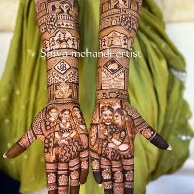 A detailed bridal mehendi featuring a clear portrait of the couple on the palms. The design is enhanced with a Ganesha motif and scenes from the wedding ceremony, creating a complete story.