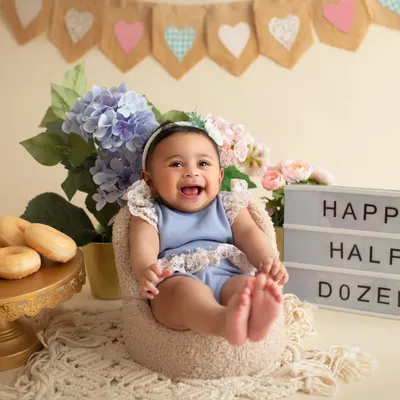 Happy Half Dozen! A half-birthday is a huge deal, and we celebrated with this adorable donut-themed setup. Look at that joyful laugh!
