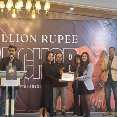 A grateful moment receiving an award for being the "Best Anchor." This recognition inspires me to continue raising the bar at every event I host.