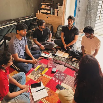An intimate Hindustani vocals session in progress. Our group classes offer a supportive environment for adults to explore traditional and contemporary music together.