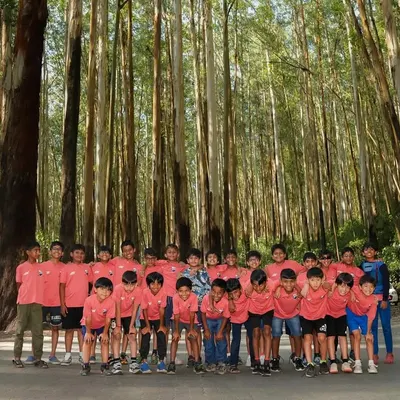 A team photo amidst the magical Nilgiri trees. On our way to Ooty, we stopped to capture this picture-perfect moment in the fresh mountain air.