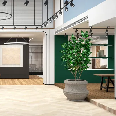 This stunning render captures our initial vision for the showroom, blending warm herringbone floors with a bold green feature wall and dramatic track lighting. Renders are a crucial step in materializing our concepts.