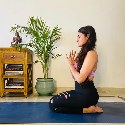 Finding stillness in a meditative pose. This is a key part of our practice, allowing us to absorb the benefits of the asanas and connect with our inner selves.