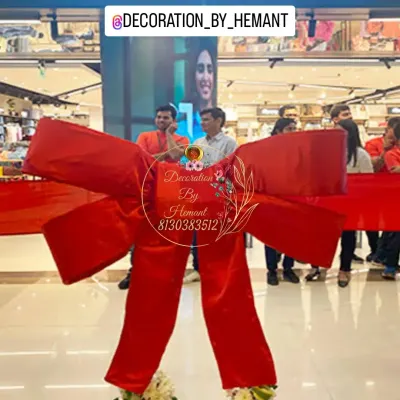 A grand opening ceremony for a Pantaloons showroom. I created this oversized red bow for the ribbon-cutting moment, adding a touch of celebration and visual appeal to the corporate event.