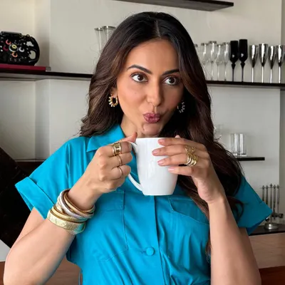 Rakul Preet glowing in our exquisite bangle stack. She pairs our chunky twisted bangles with a simple mug of coffee for an effortlessly chic morning look.